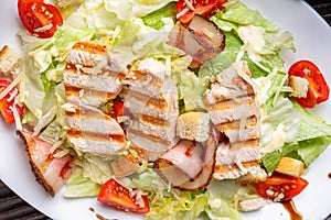 Caesar salad on dark wooden rustic background