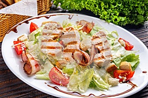 Caesar salad on dark wooden rustic background