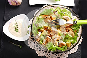 Caesar salad in glass bowl