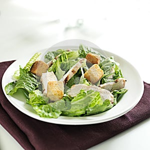 Caesar salad with grilled chicken and copy space