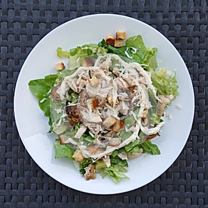 Caesar salad with grilled chicken and lettuce