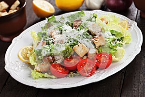 Caesar salad with lemon and cherry tomato