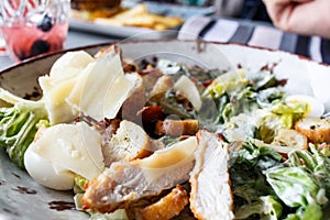 Caesar salad in a round plate