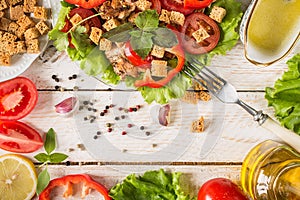 Caesar salad on rustic background.