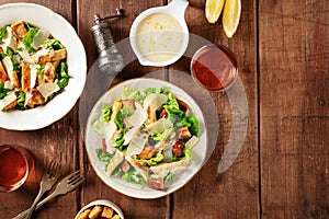 Caesar salad, shot from above on a dark rustic wooden background