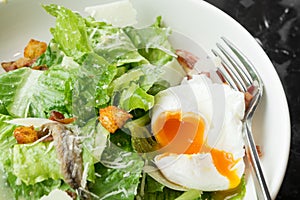 Caesar salad with soft boiled egg
