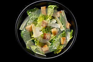 Caesar salad top view black background Generative AI