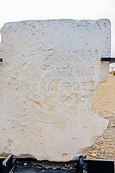 CAESAREA, ISRAEL - MAY 9, 2013: Stone monument with mention of Pontius Pilate near Herod`s palace in Caesarea Maritima