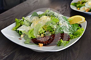 Caeser salad plate with caramelized beef