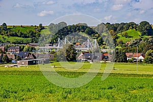 Caestert plateau with green esplanade, suspension bridge and Kanne village