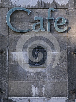 Cafe on blue stone facade