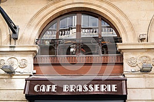 Cafe brasserie text sign word french means bar coffee on building city street restaurant classical