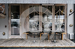 A cafe facade design with stylish elements and furniture