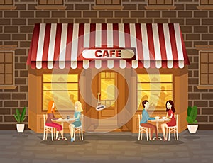 Cafe facade with evening with people drinking coffee