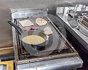 A cafe frying station working on an Ulster Fry