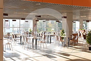 Cafe Interior. Modern cafe interior with bright room with tables and chairs nobody, large windows, modern style