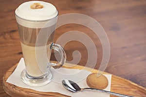 Cafe latte macchiato layered coffee in a see through glass coffee cup