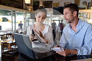 cafe owners working through their accounts