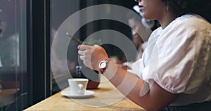 Cafe, phone and closeup of a woman typing a text message on the internet or social media. Technology, cup of coffee and