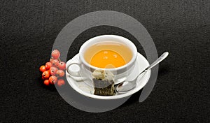 Cafe restaurant menu. Health care folk remedies. Drink aromatic beverage. Cup of tea on black background close up