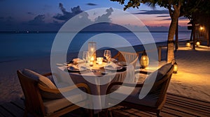 Cafe on the seaside, served table and two chairs on the seashore, romantic evening.