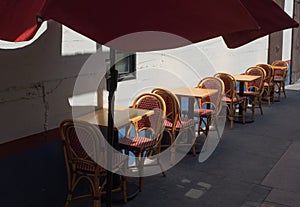 Outdoor cafe seating, red umbrella