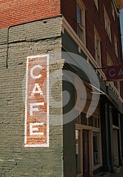 Cafe sign on historic brick building