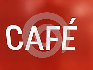 Cafe sign on a red background, close-up of photo