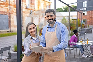 Cafe Staff Taking Orders Outdoors