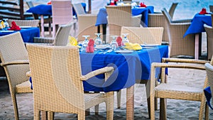 Cafe Table on a tropical sandy beach with sea on background, Nusa Dua, Bali