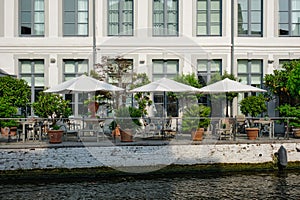 Cafe tables along canal in Bruges, Belgium