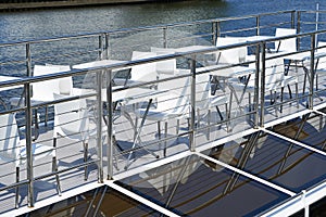 Cafe tables on deck of pleasure boat