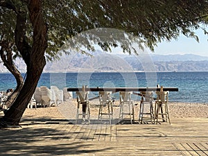 Cafe tables on Dekel Beach in Eilat