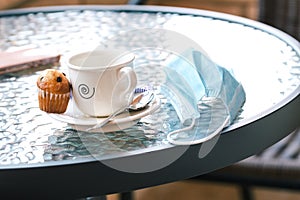 Cafe on the terrace of a bar with a mask on the table