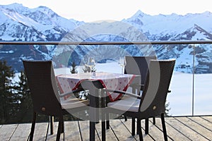 Cafe terrace in the mountains, and view of the Hohe Tauern mountain range. Austria.