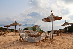 Cafe with umbrellas on the shore during the daytime