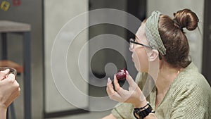 Cafes and restaurants, homeliness, communication, relatives concept - two young women sisters chatting drink tea with