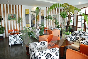 Cafeteria with green tropical indoor plant