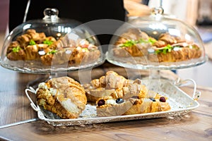 Cafeteria tray with homemade scones and croissants. fresh appetizing pastries.