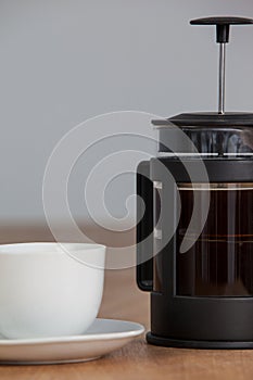 Cafetiere and a cup of black coffee