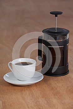 Cafetiere and a cup of black coffee