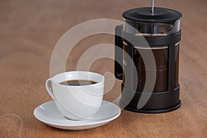 Cafetiere and a cup of black coffee