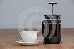 Cafetiere and a cup of black coffee