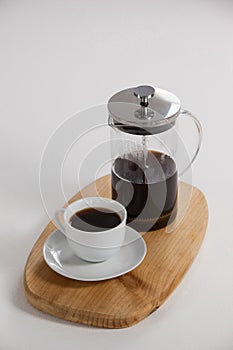 Cafetiere and a cup of black coffee