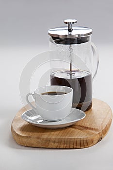 Cafetiere and a cup of black coffee