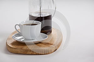 Cafetiere and a cup of black coffee