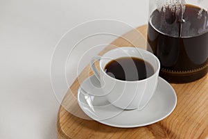 Cafetiere and a cup of black coffee