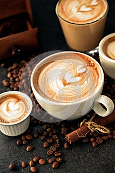 Caffe latte and a bunch of coffee beans