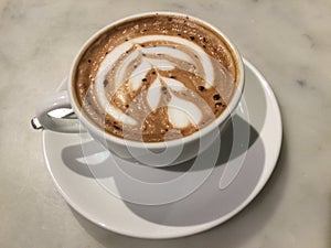 Mocaccono. Mocha. Chocolate cafe. latte art. Close up. photo