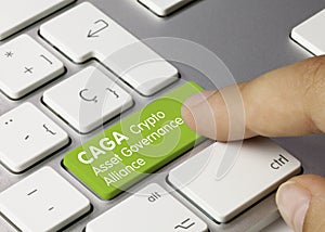 CAGA Crypto Asset Governance Alliance - Inscription on Green Keyboard Key